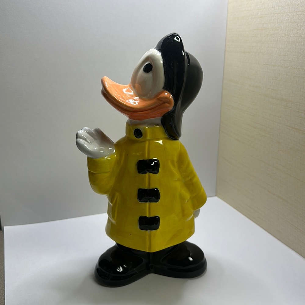 Duck in a rain coat hand painted plaster